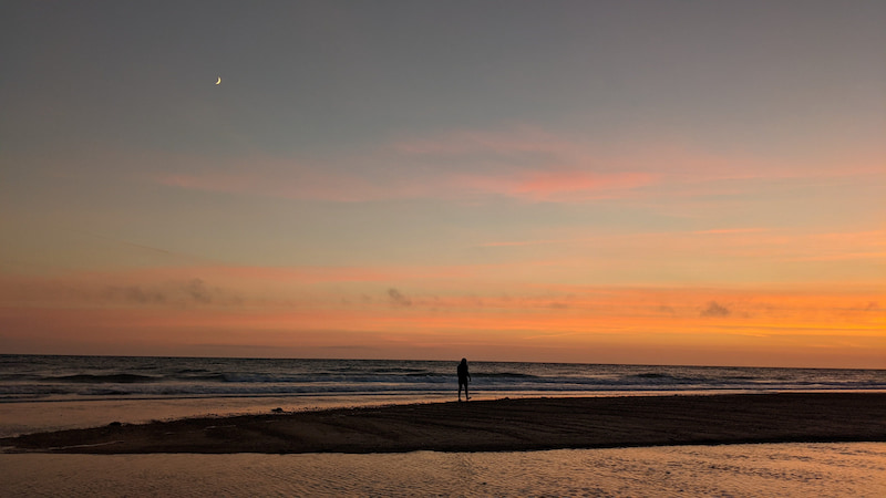 Having a sunset walk with Nora along a beach in Normandy