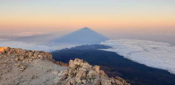 The sea of clouds covered by the Teide’s shadow
