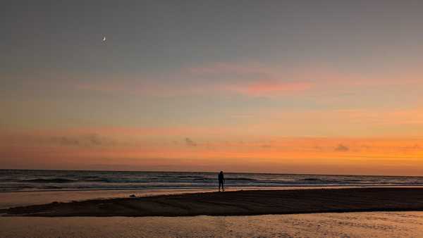 Having a sunset walk with Nora along a beach in Normandy